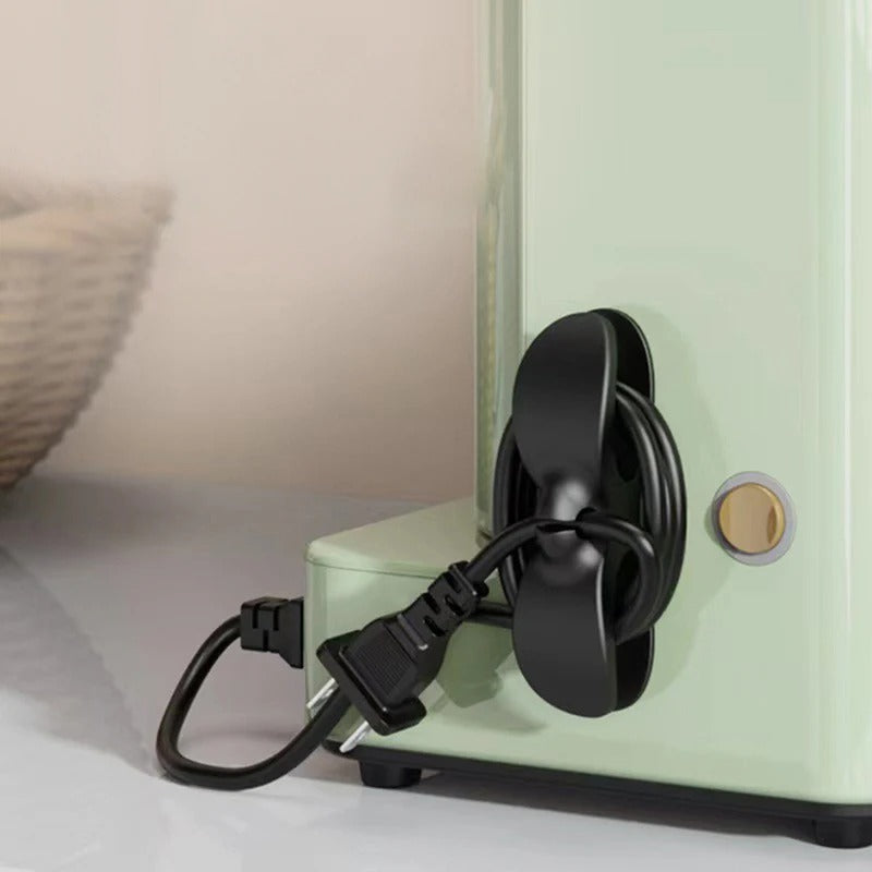 Plug holder and cable organizer designed to secure power cords and streamline wire management, keeping your workspace neat and tidy.